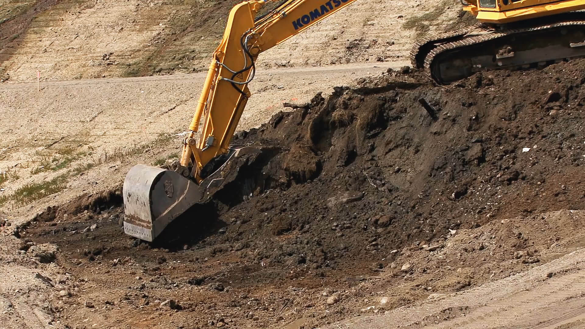 Excavator Digging Pipe